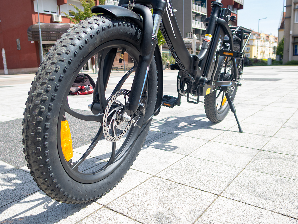 a bicycle parked on a sidewalk OneSport OT16