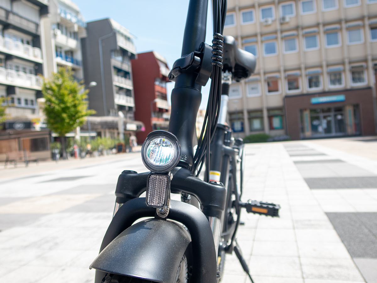 a bicycle parked on a sidewalk OneSport OT16